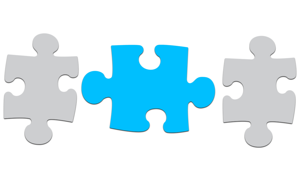 two gray puzzle pieces with a blue puzzle piece between them